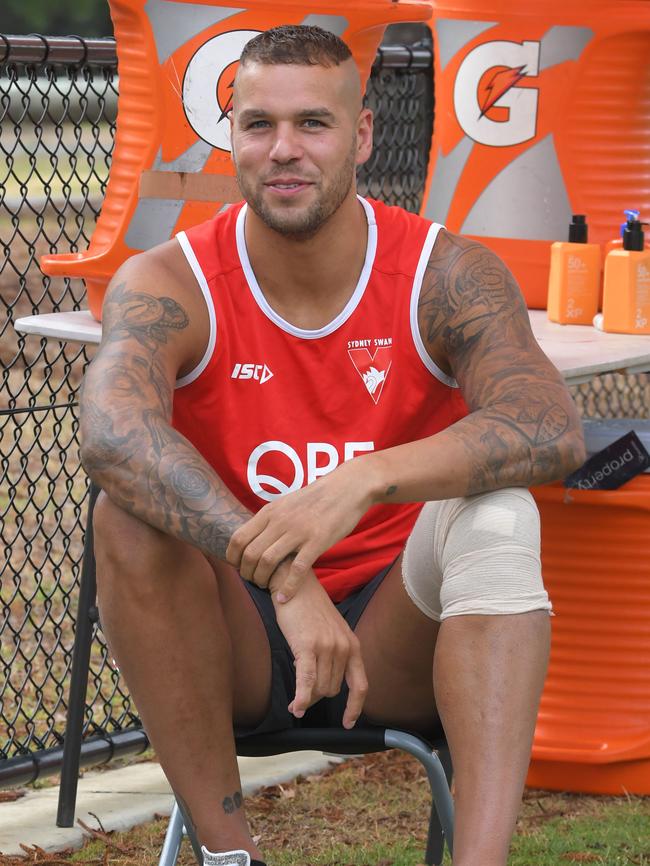 Lance Franklin nurses a strapped knee at Sydney training.