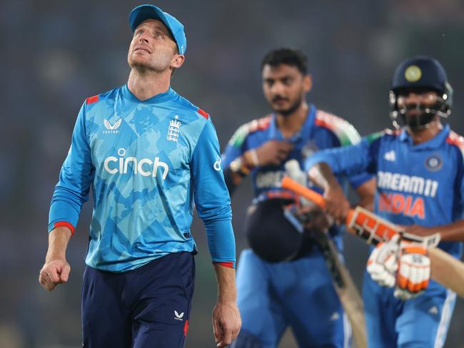 CUTTACK, INDIA - FEBRUARY 09: England captain Jos Buttler walks off the field of play after his side's four wicket defeat in front of not out batsmen Ravindra Jadeja and Axel Patel during the 2nd ODI match between India and England at Barabati Stadium on February 09, 2025 in Cuttack, India. (Photo by Michael Steele/Getty Images)