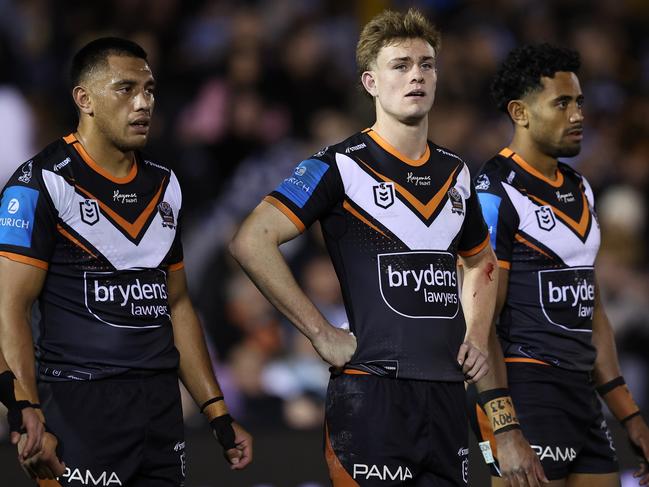 SYDNEY, AUSTRALIA - JULY 12:  Lachlan Galvin of the Wests Tigers reacts after a Sharks try during the round 19 NRL match between Cronulla Sharks and Wests Tigers at PointsBet Stadium on July 12, 2024, in Sydney, Australia. (Photo by Brendon Thorne/Getty Images)