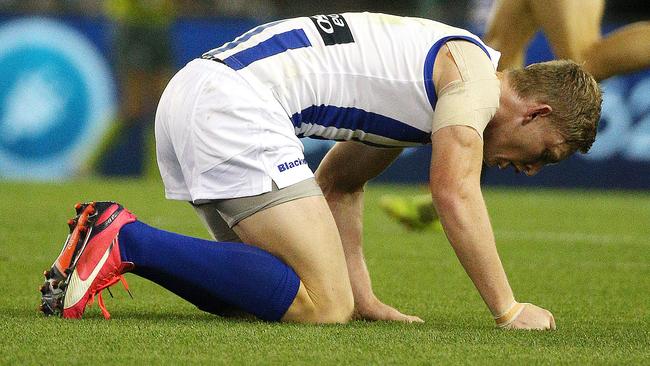 Kangaroo Jack Ziebell spitting blood on the field. Picture: George Salpigtidis