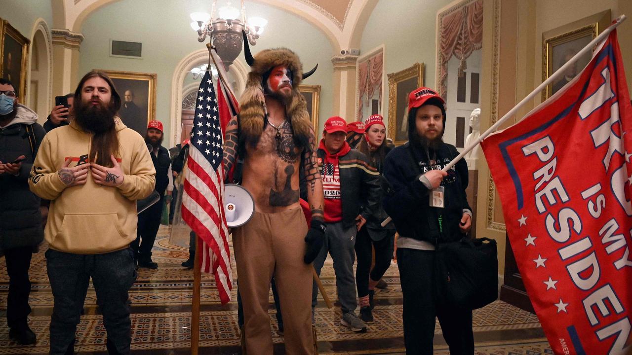 Supporters of US President Donald Trump, including member of the QAnon conspiracy group, entered the US Capitol on January 6, 2021. Picture: Saul Loeb/AFP