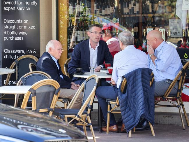 NSW Premier Dominic Perrottet and Transport Minister David Elliott spotted meeting former Prime Minister John Howard and businessman Chris Corrigan at Piato restaurant in McMahon's Point.