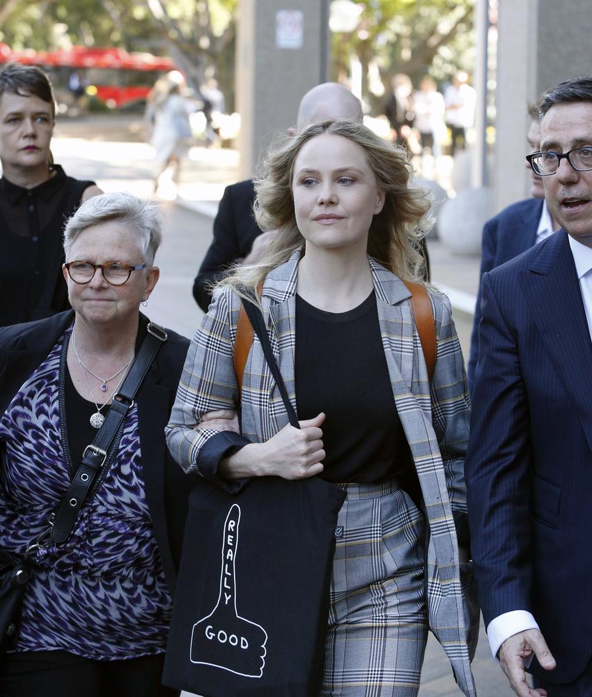 Eryn Jean Norvill with her parents after giving evidence on Tuesday. Picture: Richard Dobson