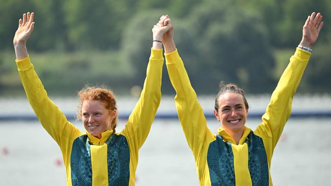 Australia's bronze medallists Annabelle Mcintyre and Jess Morrison celebrate on the podium during the medal ceremony after the women's pair final rowing competition at Vaires-sur-Marne Nautical Centre in Vaires-sur-Marne during the Paris 2024 Olympic Games on August 2, 2024. (Photo by Bertrand GUAY / AFP)