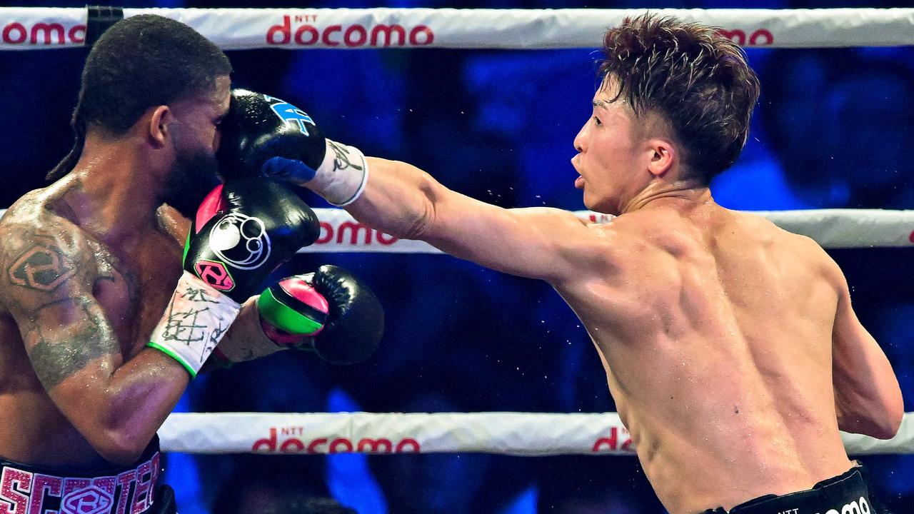 Naoya Inoue of Japan (R) and Stephen Fulton of the US fight in the WBC, WBO super bantamweight world title match at Ariake Arena in Tokyo on July 25, 2023. (Photo by Kazuhiro NOGI / AFP)