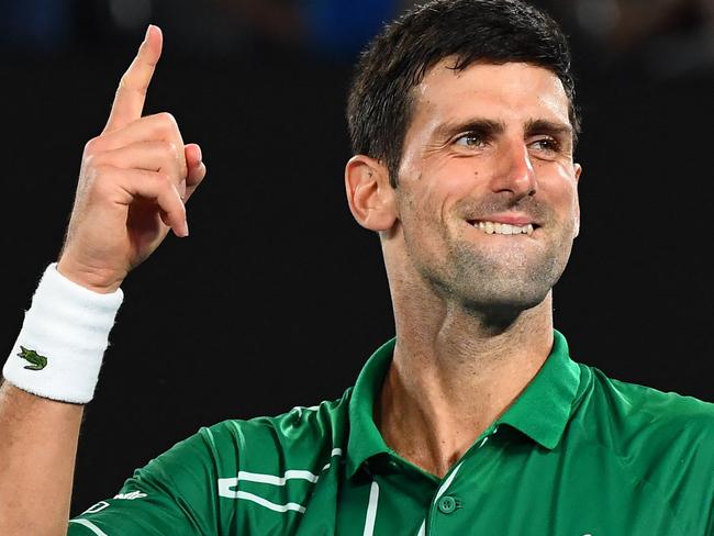 (FILES) This file photo taken on January 30, 2020 shows Serbia's Novak Djokovic celebrating after beating Switzerland's Roger Federer during their men's singles semi-final match on day 11 of the Australian Open tennis tournament in Melbourne. - World number one Novak Djokovic won a stunning victory on January 10, 2022 over the Australian government, overturning the cancellation of his visa on Covid-19 health grounds, and ending his detention. (Photo by William WEST / AFP) / -- IMAGE RESTRICTED TO EDITORIAL USE - STRICTLY NO COMMERCIAL USE --