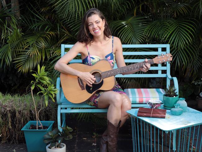 Award-winning singer-songwriter Amber Lawrence at home in Mascot with some of her favourite things. Picture: John Fotiadis