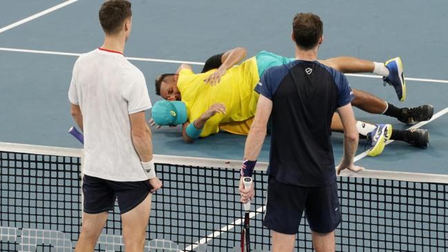 Kyrgios and de Minaur celebrate the win.