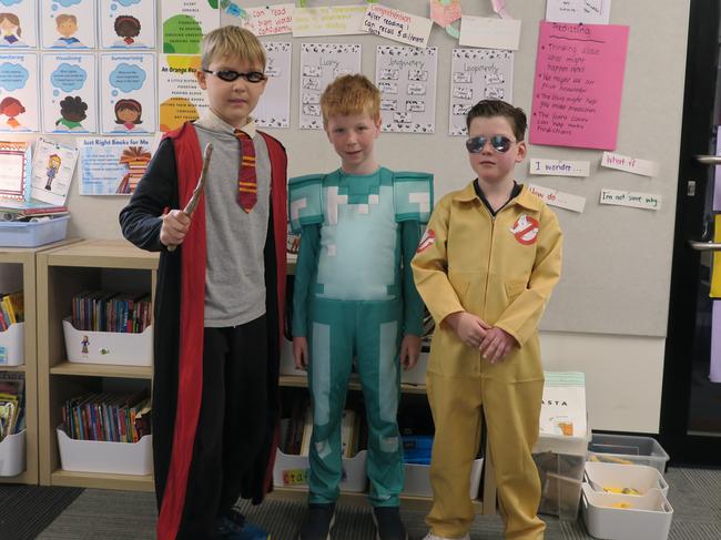 Harry Potter is always a popular choice as Nils Balogh shows with his Elwood Primary School friends Oscar Maudsley (a Minecraft character) and Jackson Hitch (a Ghost Buster). Picture: Gemma Scerri.