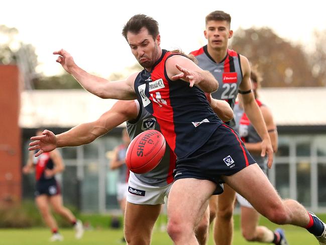 MELBOURNE, AUSTRALIA - JUNE 05: Corey Ellis of Coburg kicks the ball during the round 11 VFL match between Coburg and Frankston at Piranha Park on June 05, 2022 in Melbourne, Australia. (Photo by Kelly Defina/AFL Photos/via Getty Images)