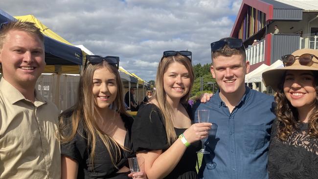 Tyson Johnson, Logan Kickbusch, Tyler Chambers, Makayla Kickbusch, and Heleena Devey enjoy a day of fun at the Gympie Races on Saturday, July 15, 2023.