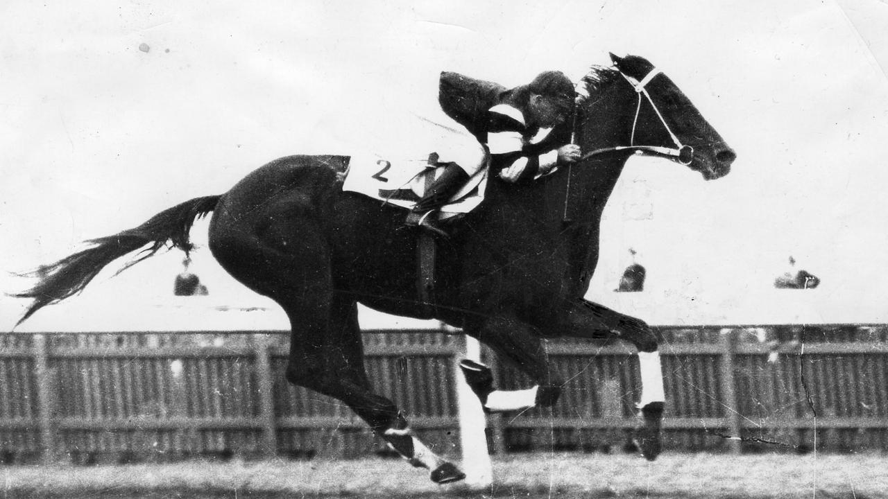 Phar Lap ridden by jockey Billy Elliott winning the Elder Stakes race at Morphettville in May, 1930.