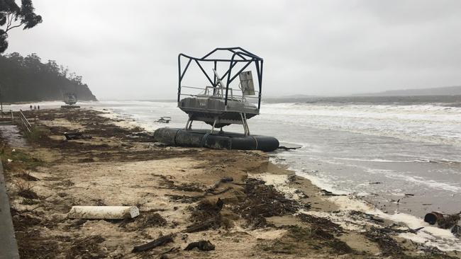 Salmon feeders washed up on Kingston Beach during wild storms in southern Tasmania in May last year. Picture: Shelly Belly