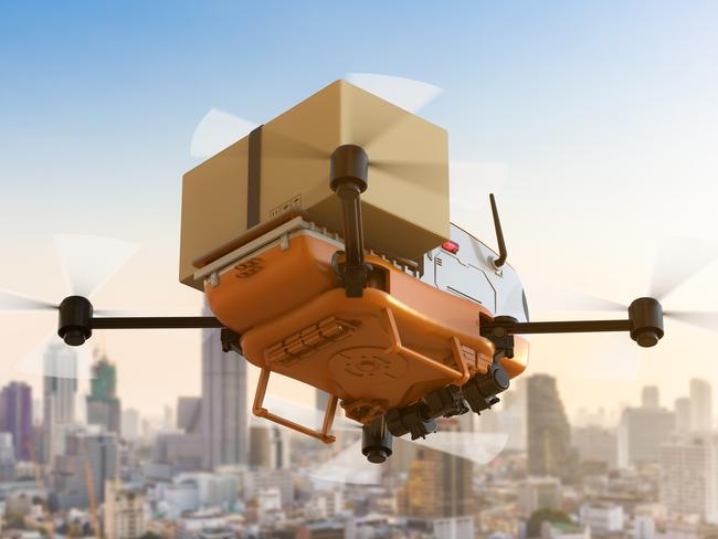 Automation warehouse concept withÂ 3d rendering delivery drone or robot holding cardboard box