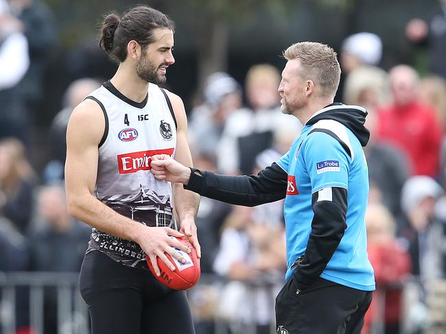 Brodie Grundy gets some Grand Final week tips from Collingwood coach Nathan Buckley. Picture: Michael Klein