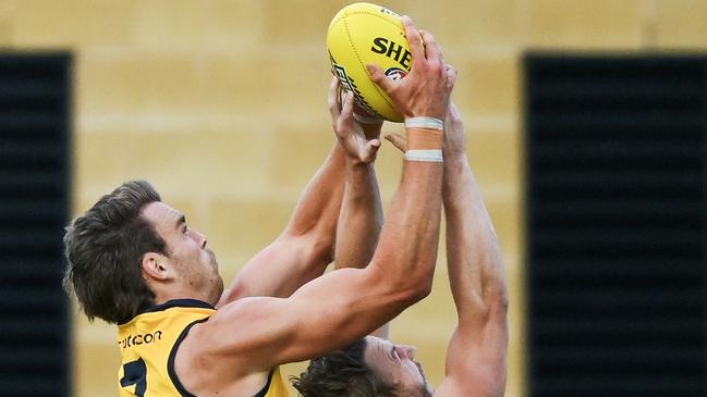 ADELAIDE, AUSTRALIA - FEBRUARY 23: Riley Thilthorpe of the Crows  marks over   Trent McKenzie of the Power  during an AFL practice match between Port Adelaide Power and Adelaide Crows at Alberton Oval on February 23, 2024 in Adelaide, Australia. (Photo by Mark Brake/Getty Images)