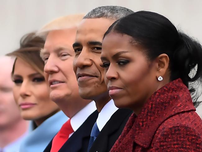 TOPSHOT - L-R: First Lady Melania Trump, President Donald Trump,former President Barack Obama, Michelle Obama at the US Capitol after inauguration ceremonies at the in Washington, DC, on January 20, 2017. / AFP PHOTO / JIM WATSON