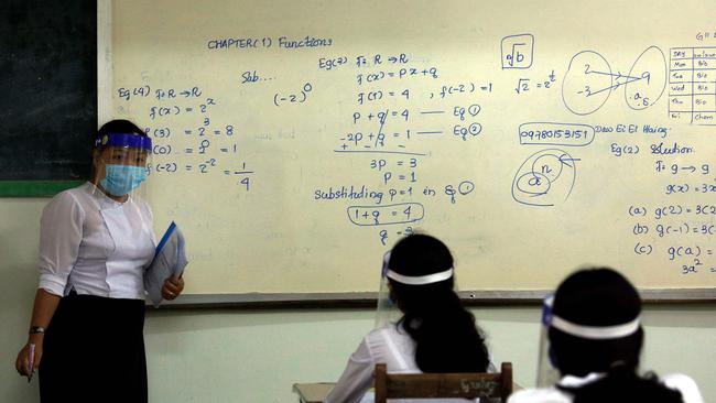 A ‘new normal’ classroom gets underway in Yangon. Picture: AFP