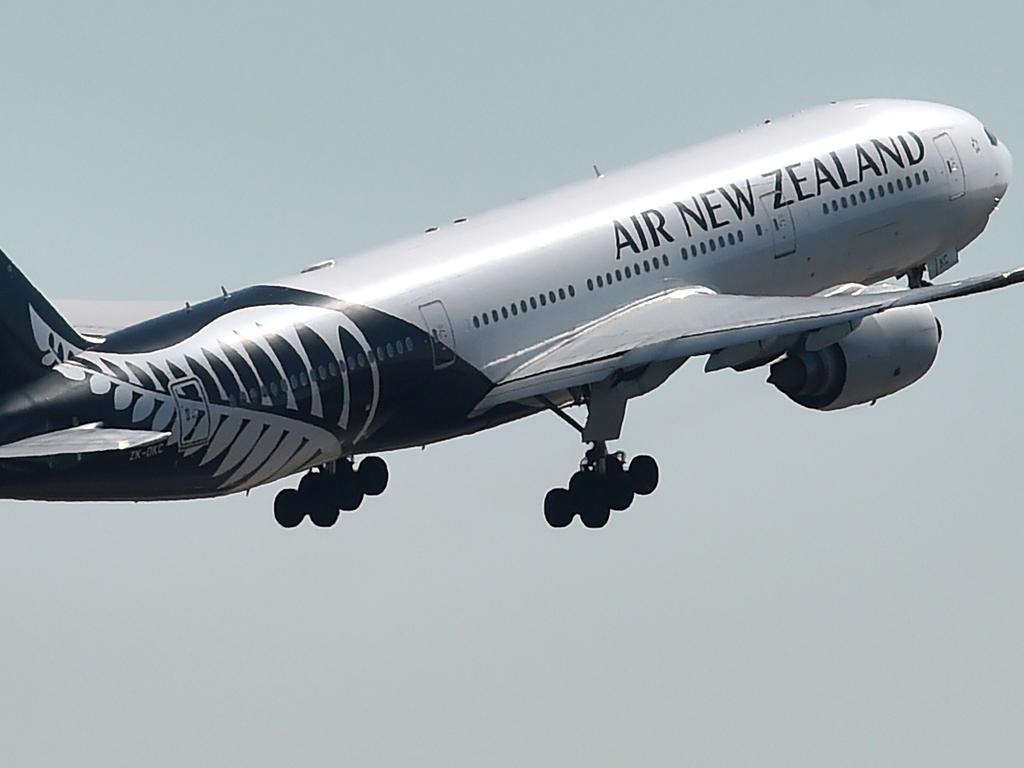 An Air New Zealand plane takes off from the airport in Sydney on August 23, 2017. Air New Zealand posted a 17.5 percent fall in annual net profit on August 23 as increased competition hit the carrier's bottom line. / AFP PHOTO / Peter PARKS