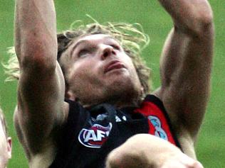 James Hird takes a mark in the last quarter. 2005 Anzac Day match. Essendon v Collingwood. MCG.