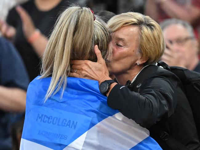 Scotland's Eilish McColgan celebrates with her mother after winning the women's 10,000m final athletics event at the Alexander Stadium, in Birmingham on day six of the Commonwealth Games in Birmingham, central England, on August 3, 2022. (Photo by Glyn KIRK / AFP)