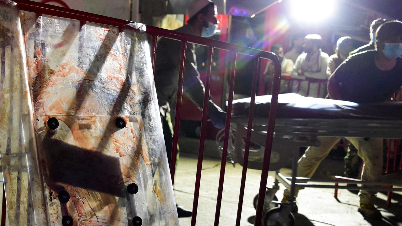 Medical staff move a stretcher to bring injured people for treatment after two powerful explosions. Picture: Wakil Kohsar/AFP