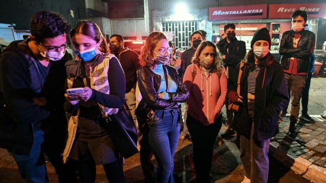 Fans gather outside the hotel. Picture: AFP