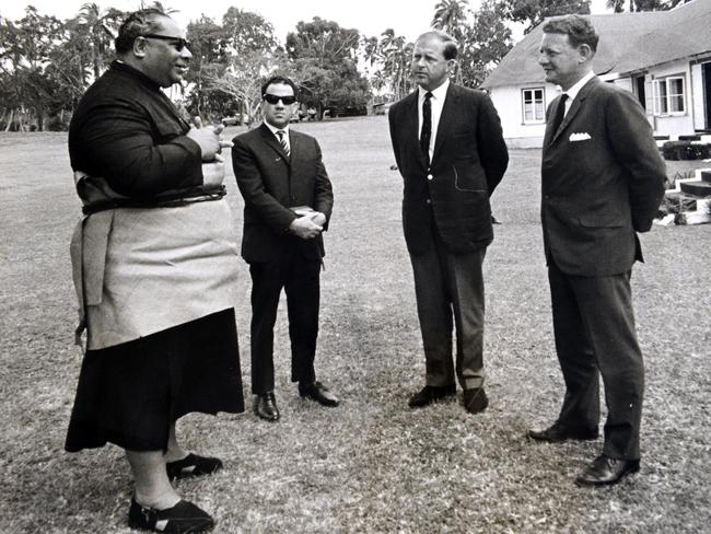 His Majesty Topou IV of Tonga (left) and Peter Warner (far right) after he rescued the six castaways. Picture: John Gass