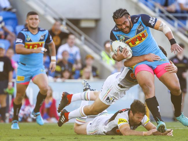 Konrad Hurrell of the Titans (right) is tackled during the Round 22 NRL match between the Gold Coast Titans and the Penrith Panthers at Cbus Super Stadium on the Gold Coast, Saturday, August 11, 2018. Picture: AAP Image/Glenn Hunt