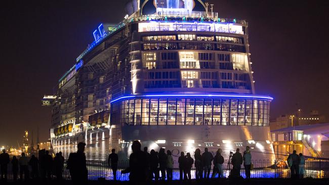 SOUTHAMPTON, ENGLAND - OCTOBER 31: People gather to see the cruise ship Quantum of the Seas which is currently docked at Southampton on October 31, 2014 in Southampton, England. Billed as the world's first smartship, Royal Caribbean's Quantum of the Seas is claimed to be the most high-tech cruise ship in the world, with high tech modifications such as virtual balconies in windowless rooms and features such as the first dodgem ride on water, and a skydiving simulator. The ship will shortly begin its voyage from Southampton, where it docked earlier this week, to New York before relocating to the Caribbean for the 2014-15 season. (Photo by Matt Cardy/Getty Images)