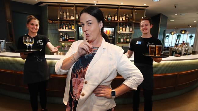 Southport RSL is undergoing a revamp to mark a new era for the venue, but exactly what is a well guarded secret. RSL Manager Lisa Traynor keeping it quiet in front of bar staff Jemma Packwood and Cameron Knapp. Picture: Glenn Hampson