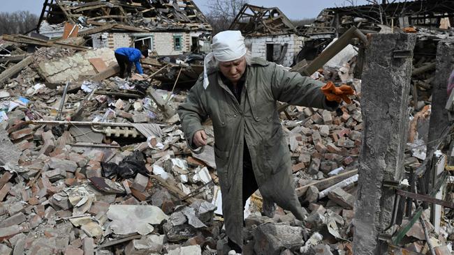 TSvitlana Zavaly, 67, walks over the rubble of her house destroyed by a Russian bomb in the village Velyka Pysarivka. Picture: Genya Savilov/AFP