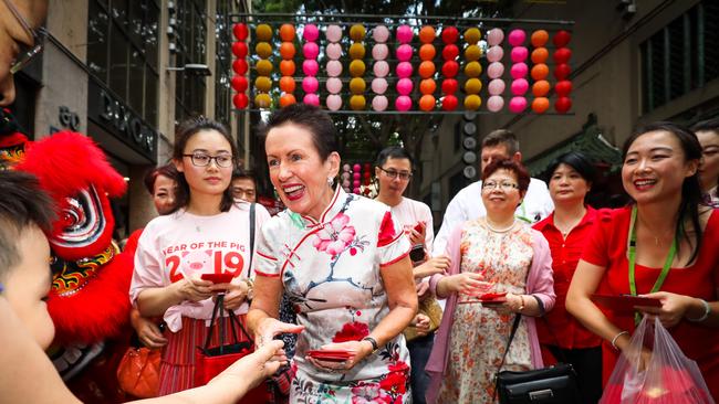 Sydney's Lord Mayor Clover Moore handing out lucky red envelopes in Chinatown. Picture: Katherine Griffiths