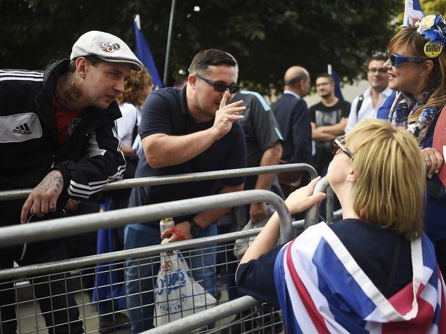 Pro-leave and pro-remain protesters demonstrate with one another outside parliament in London. Picture: Getty Images