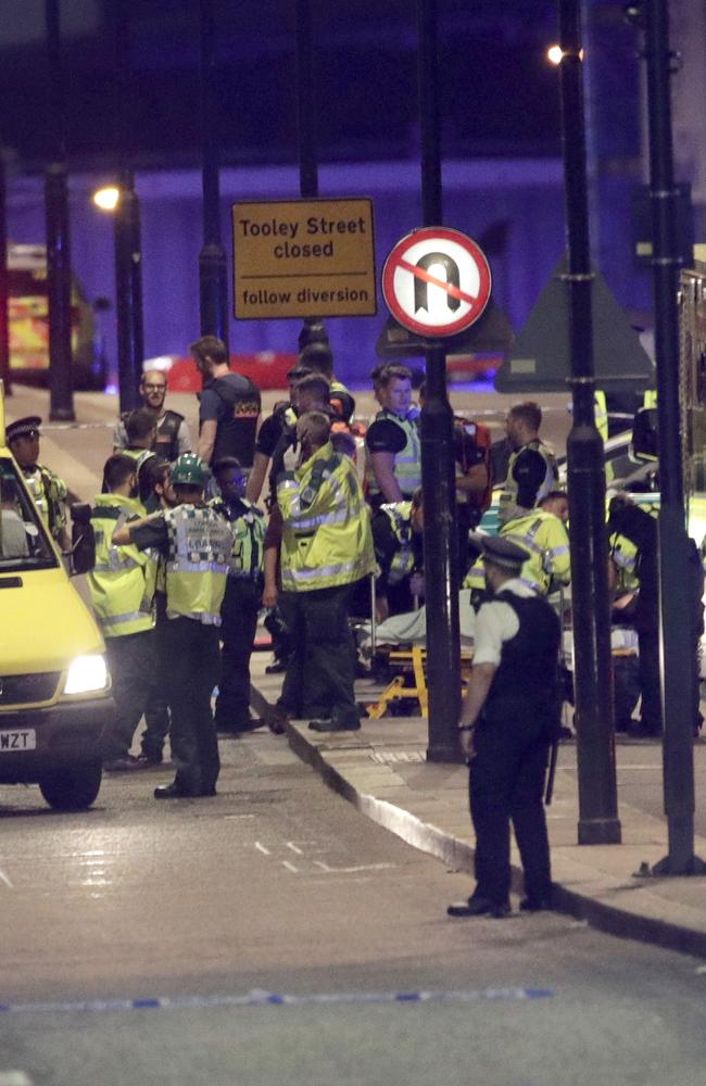 Emergency personnel tend to wounded on London Bridge. Picture: AP