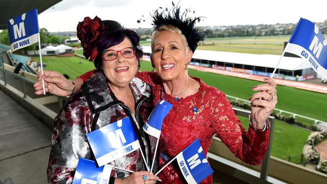 Debbie Kepitis with fellow Winx co-owner Patty Tighe — and Go Winx flags. Picture: Kylie Else