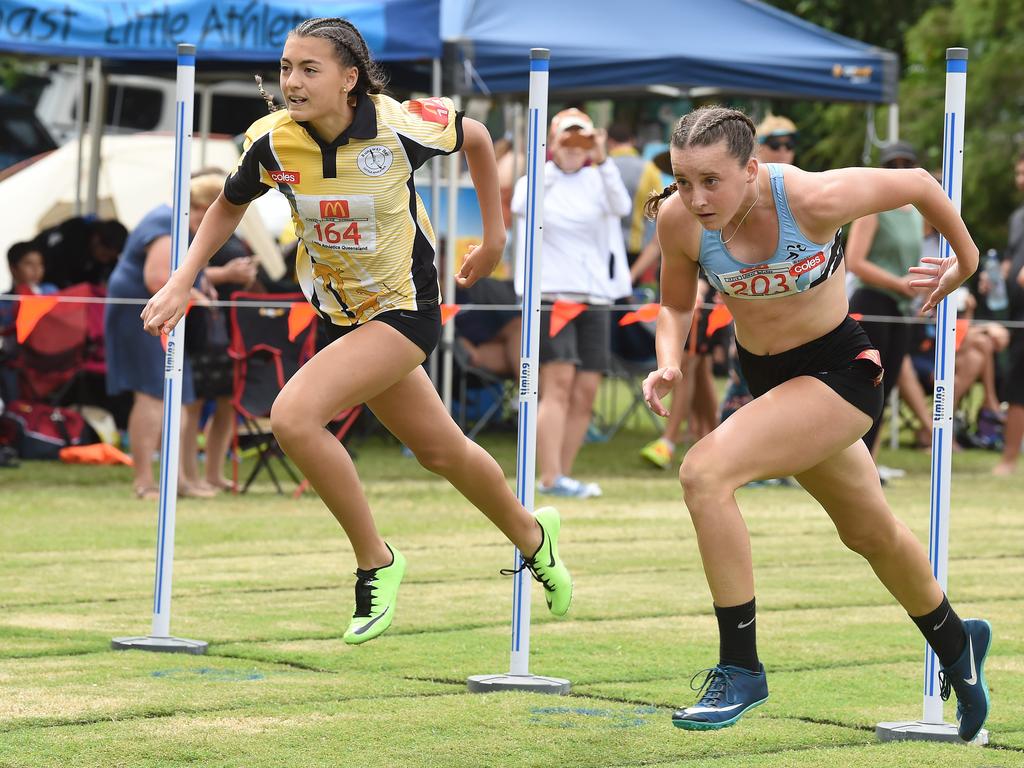 South Coast Little Athletics Titles at Pizzey Park in Miami. Girls 100 metre 14 yrs. Amali Butcher (on right) just beats Dior Scholz over the line. Picture: Lawrence Pinder