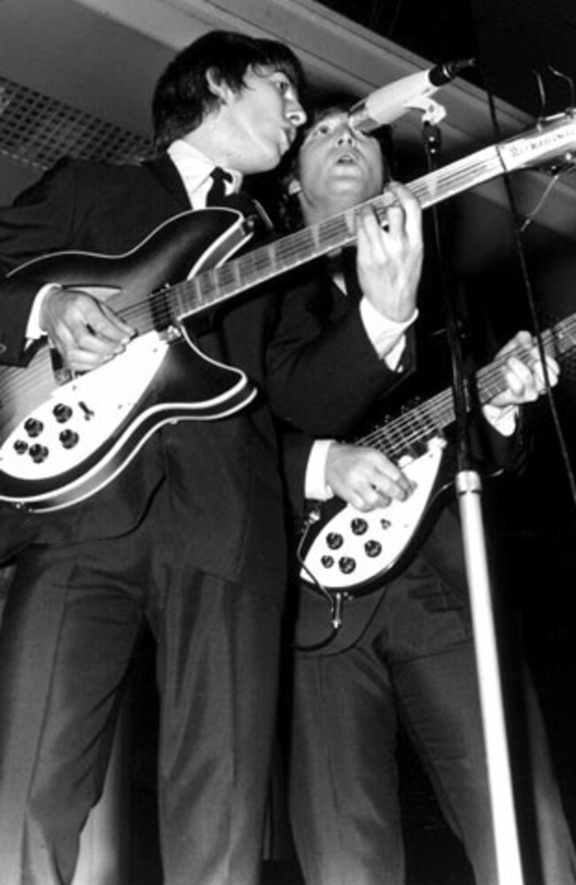 June 1964: George Harrison and John Lennon of The Beatles at Festival Hall. Picture: Herald and Weekly Times