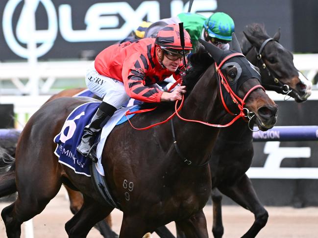 MELBOURNE, AUSTRALIA - JULY 15: Jarrod Fry riding Albanian I Am winning Race 2, the L.v Lachal Handicap,  during Melbourne Racing at Flemington Racecourse on July 15, 2023 in Melbourne, Australia. (Photo by Vince Caligiuri/Getty Images)