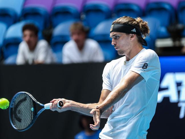 Germany's Alexander Zverev hits a return in his United Cup match in Perth. He will play a mixed-doubles event during AO Opening Week. Picture: Colin Murty/AFP