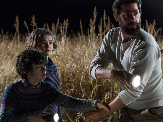 Left to right: Noah Jupe plays Marcus Abbott, Millicent Simmonds plays Regan Abbott and John Krasinski plays Lee Abbott in A QUIET PLACE, from Paramount Pictures.