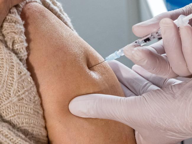 DIPPOLDISWALDE, GERMANY - MARCH 15: Nurse Susann Rettberg (R) inoculates a local resident with the AstraZeneca vaccine against COVID-19 in Saxony during the coronavirus pandemic on March 15, 2021 in Dippoldiswalde, Germany. Saxony authorities are launching a pilot project today in which 39 private medical practices statewide will begin administering COVID vaccinations. Similar projects are underway across Germany in an effort to expand the pace and scope of vaccinations, though efforts are still being hampered by a shortage of vaccines. (Photo by Jens Schlueter/Getty Images)