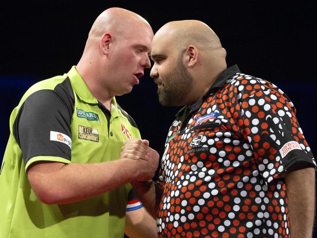 Michael van Gerwen (left) and Kyle Anderson at the Brisbane Darts Masters last night. Picture: Richard Walker/AAP