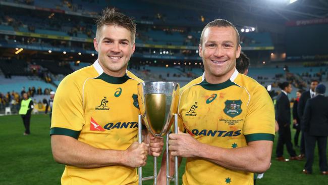 SYDNEY, AUSTRALIA - AUGUST 08: Drew Mitchell and Matt Giteau of the Wallabies pose with the Rugby Championship trophy after winning the Rugby Championship match between the Australia Wallabies and the New Zealand All Blacks at ANZ Stadium on August 8, 2015 in Sydney, Australia. (Photo by Cameron Spencer/Getty Images)