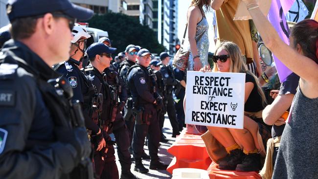 Police and protesters face off in Brisbane’s CBD. Picture: Darren England/AAP