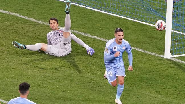 Jamie Maclaren of Melbourne City beats goalkeeper Daniel Lopar of the Wanderers to score the second goal Picture: AAP