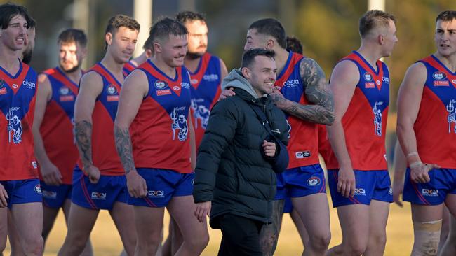 Mernda players celebrate a win. Picture: Andy Brownbill