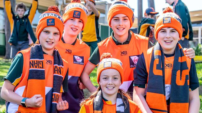 GWS Giants fans (front) Sienna Rudd and (back) Alex Vickers, Lachlan Vickers, Trent Seymour and Nicholas Decelis at Winston Hills Public School. Picture: Monique Harmer.