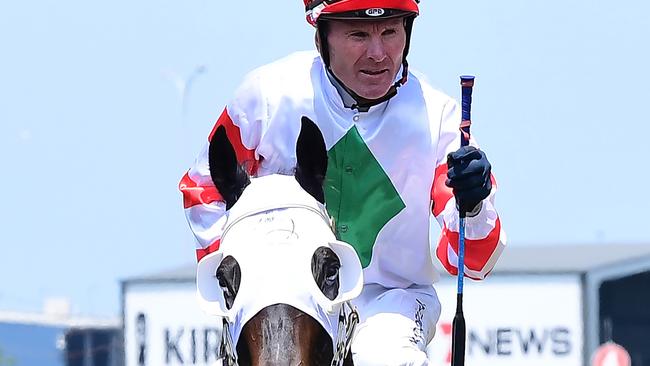 Jockey Paul Hamblin giving the fist pump after winning on Hard Stride. Picture: Grant Peters/Trackside Photography