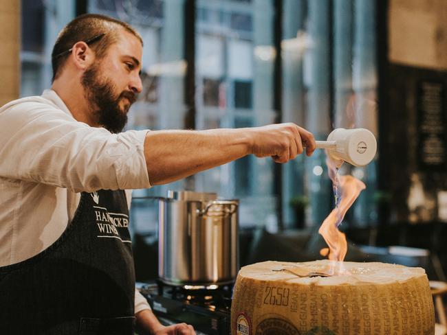 A Madame Truffle and Handpicked Cellar Door pop-up is offering a truffle pasta mixed in a flaming cheese wheel, topped with fresh shavings of truffle. Picture: Nastia Gladushchenko